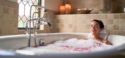 Girl relaxing in bathtub