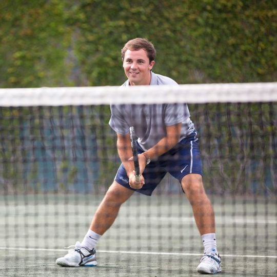A guy playing tennis