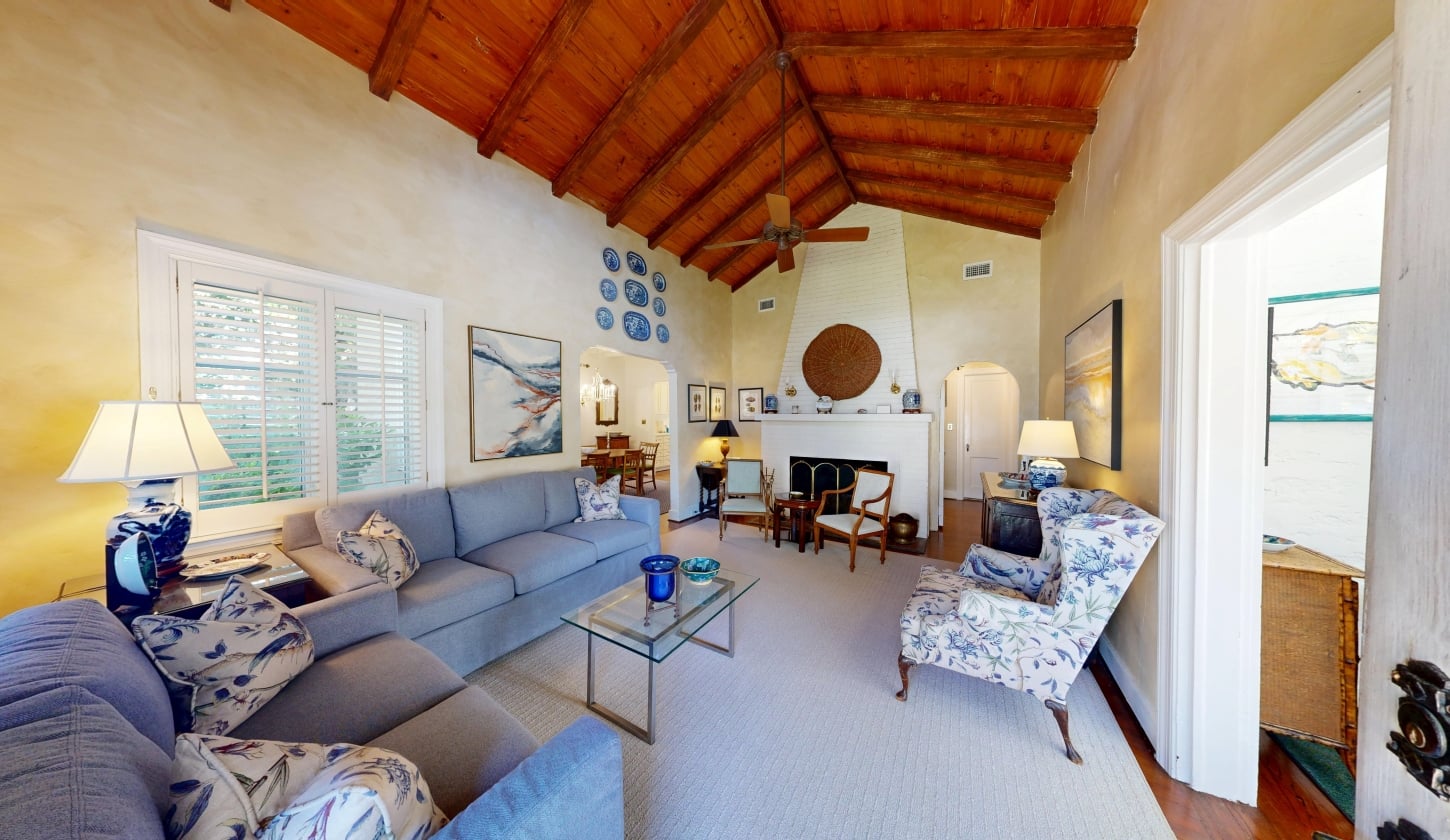 A spacious family area with high ceilings and comfortable seating