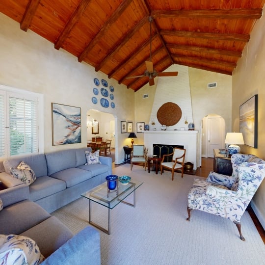 A spacious family area with high ceilings and comfortable seating