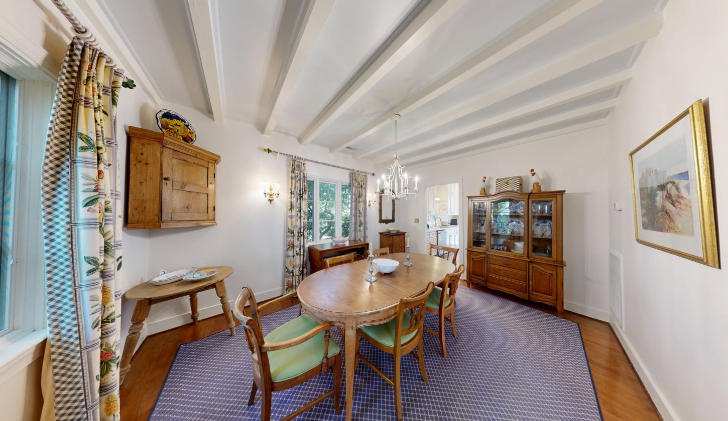 An oval dining table in an elegant dining room