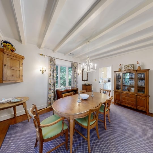 An oval dining table in an elegant dining room