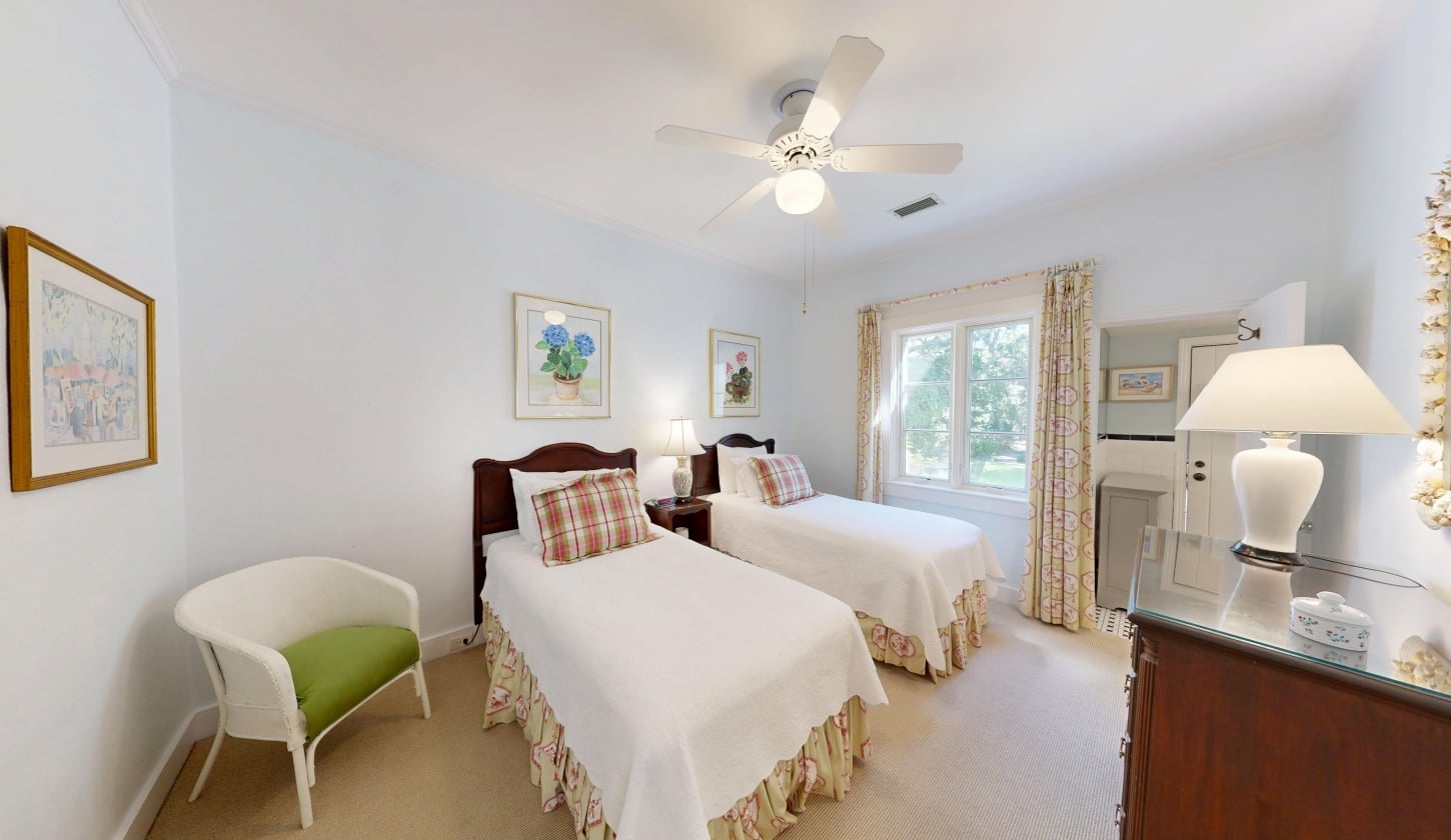 Two twin beds separated by a night table