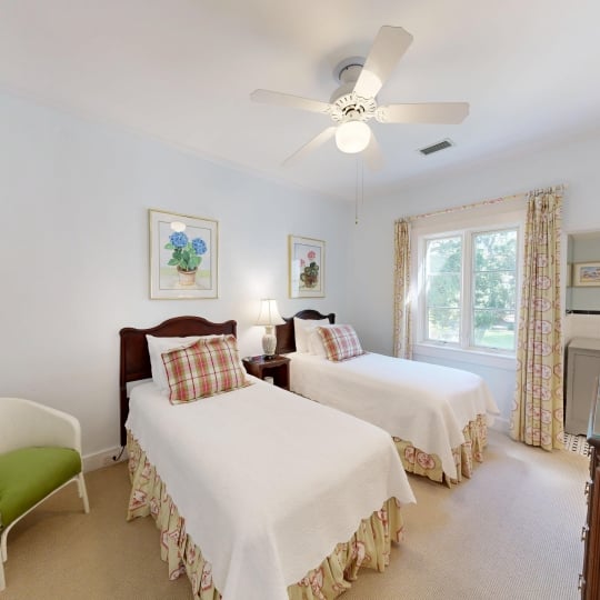 Two twin beds separated by a night table