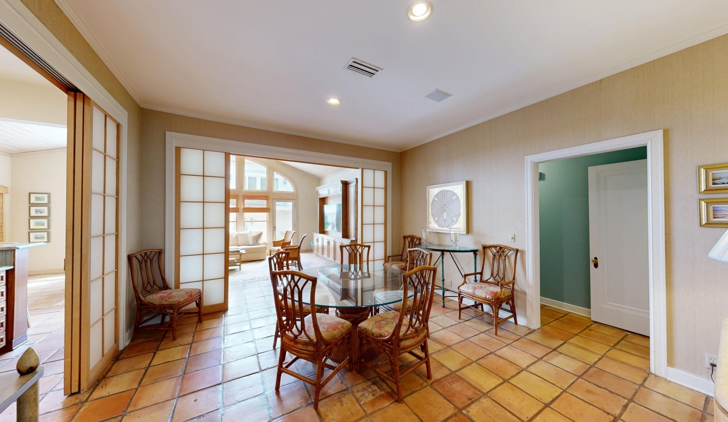 An open concept dining room with a circular table