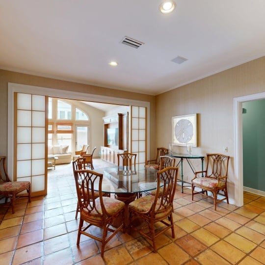 An open concept dining room with a circular table