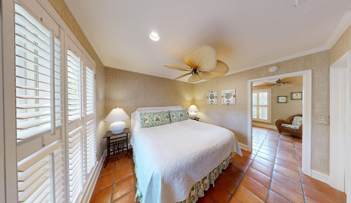 A bright bedroom with hardwood floors