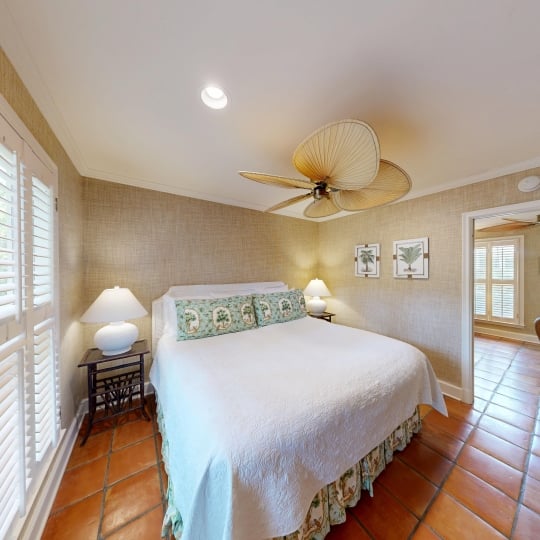 A bright bedroom with hardwood floors
