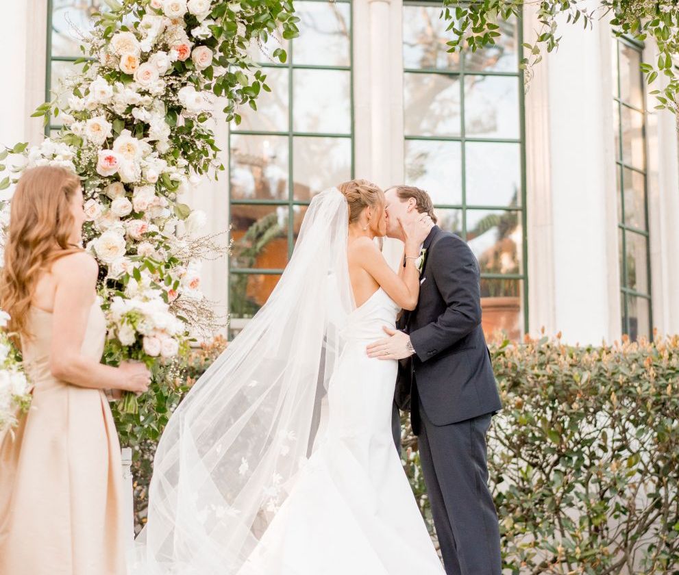 groom and bride kissing