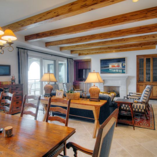 Living room with exposed wood ceiling