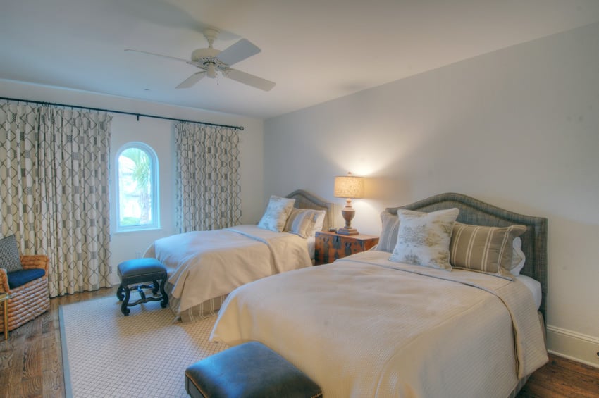 Bedroom with two queen beds and dark teal undertones