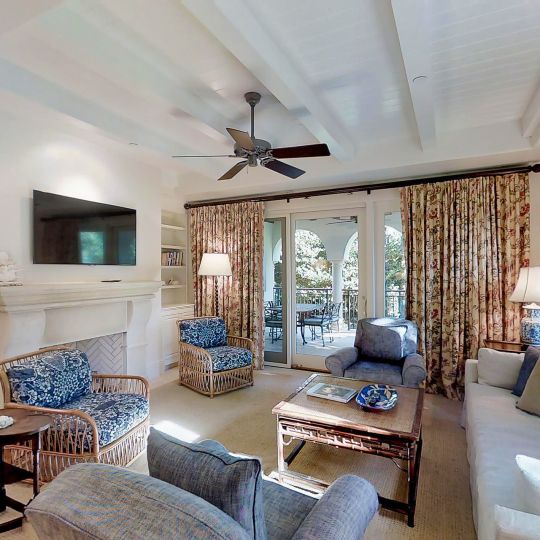 living room with blue chairs and fireplace