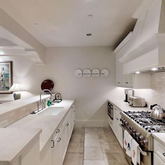 white kitchen with steal appliances