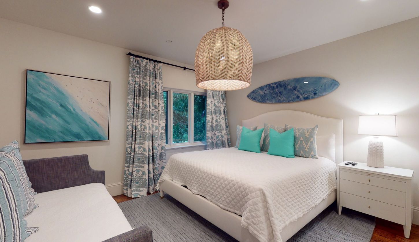 bedroom with king bed and aqua undertones