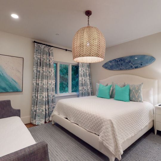 bedroom with king bed and aqua undertones