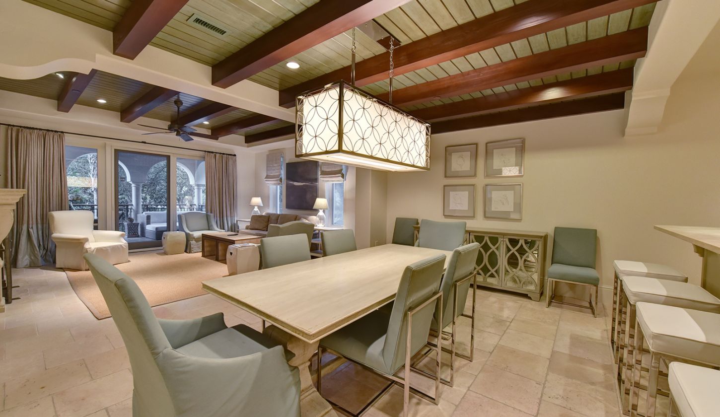 long kitchen Table with living room in the background