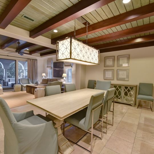 long kitchen Table with living room in the background