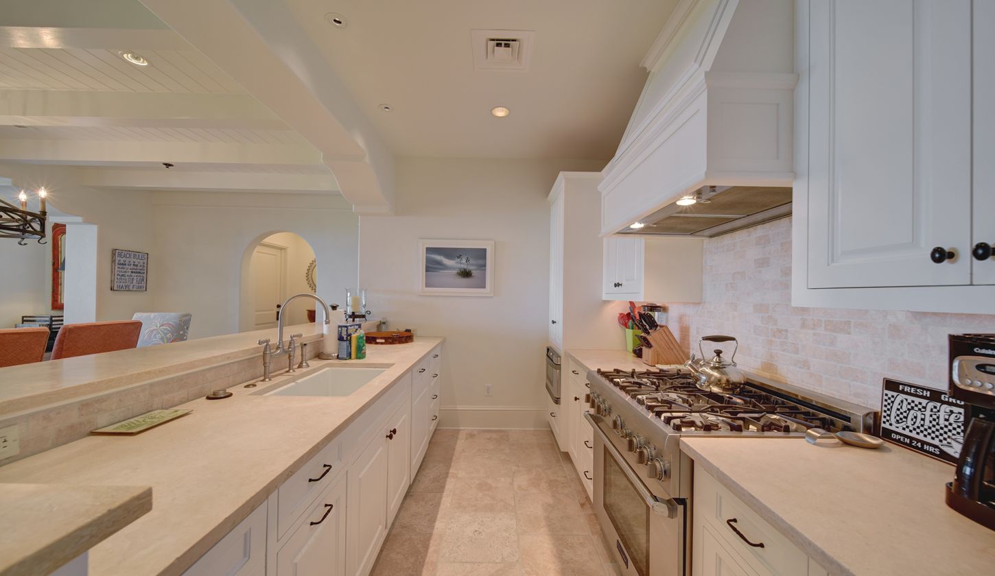 White kitchen with steel appliances