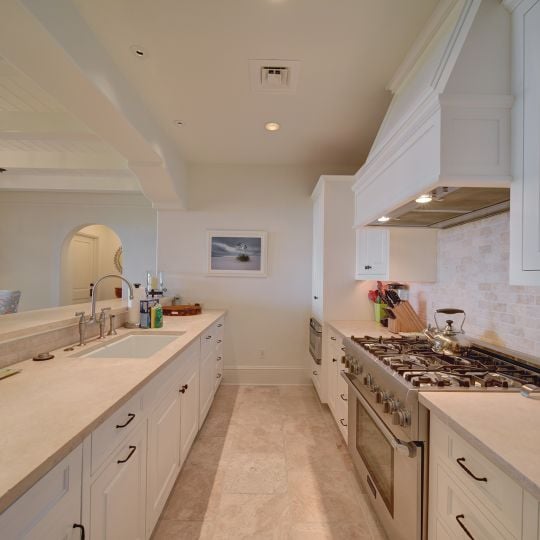 White kitchen with steel appliances