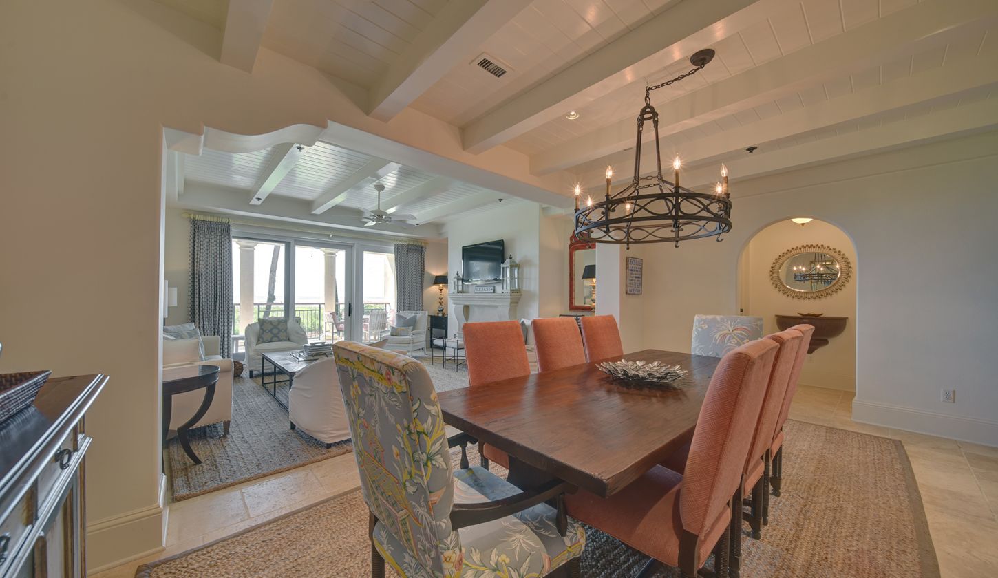 Dining room table with pink chairs
