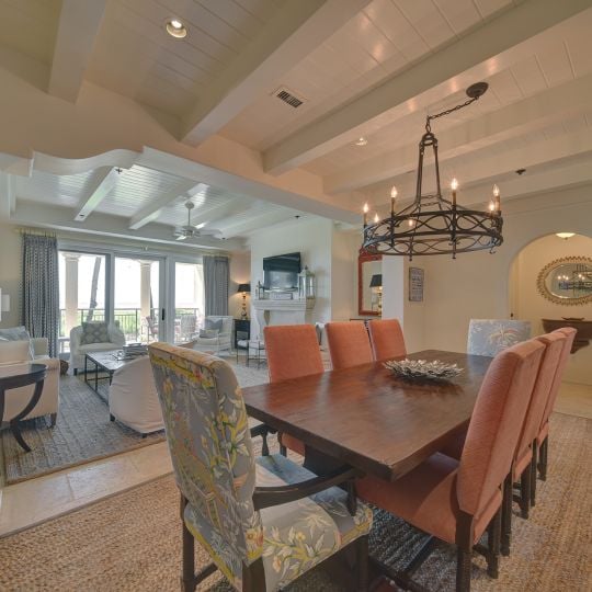 Dining room table with pink chairs