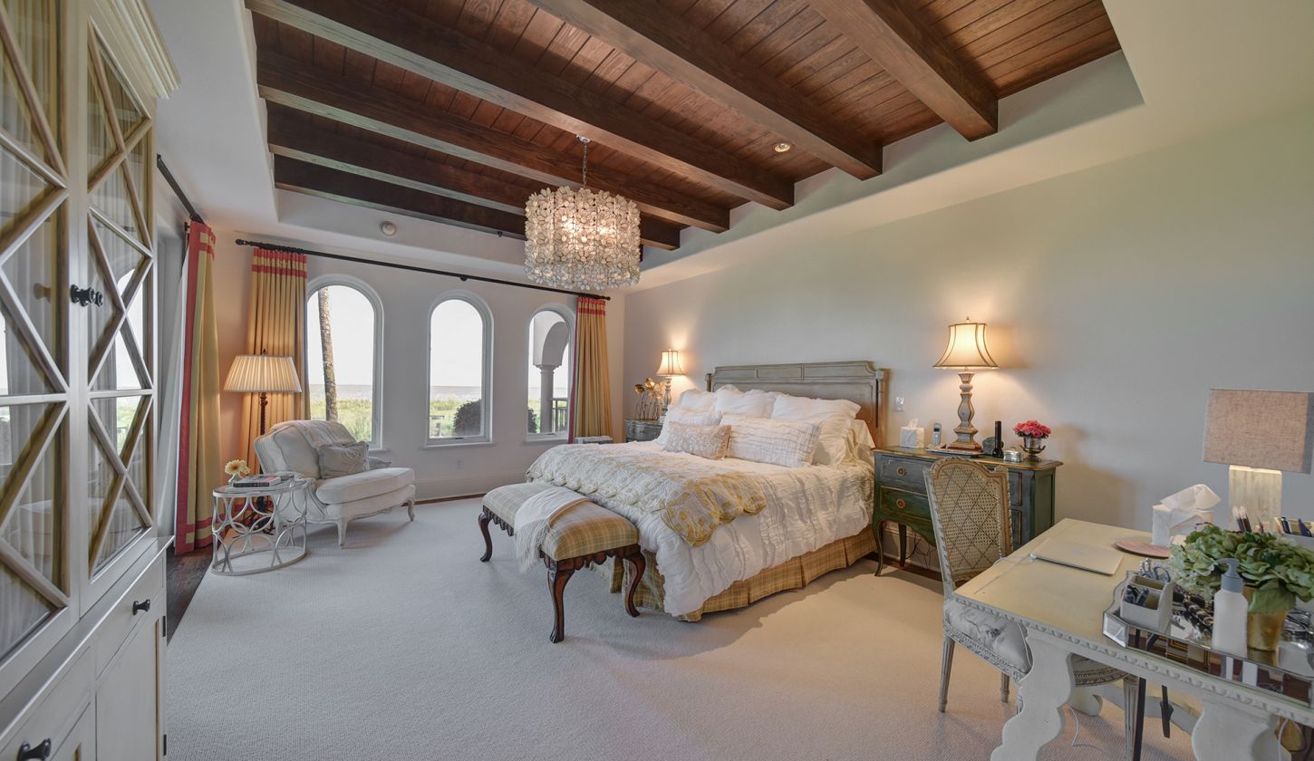 Bedroom with desk and plenty of windows