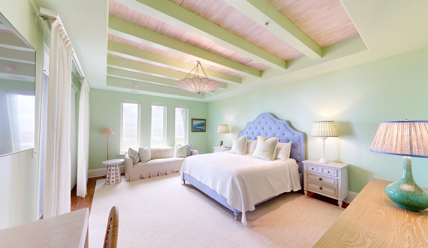 A bright room with a king bed and plenty of natural light