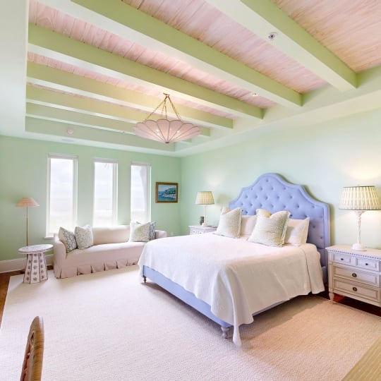 A bright room with a king bed and plenty of natural light