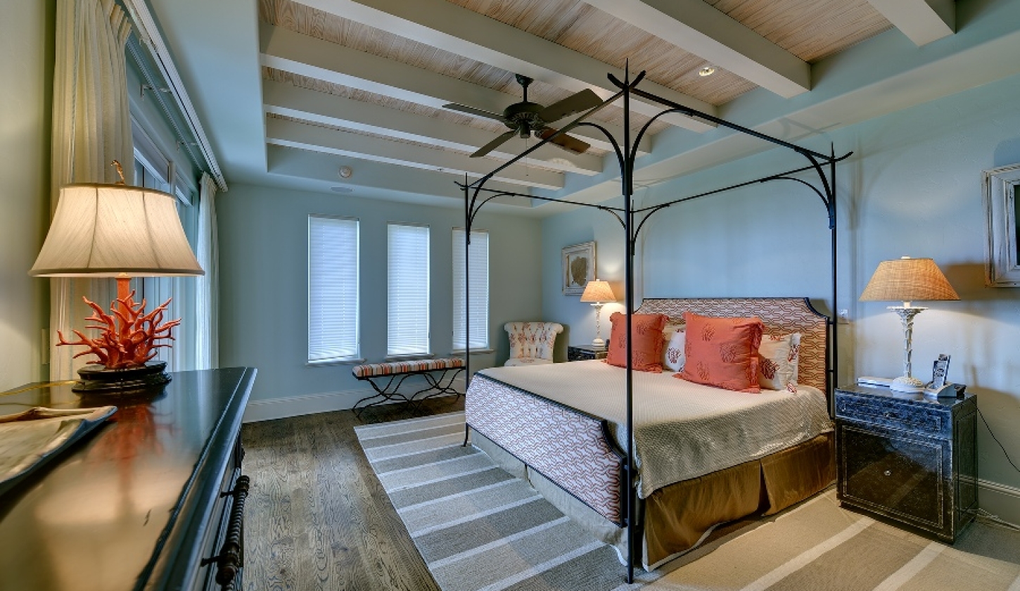 Pale blue bedroom with queen bed