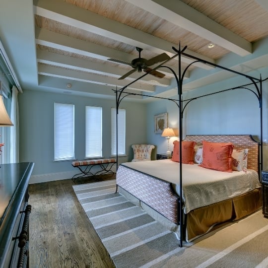 Pale blue bedroom with queen bed