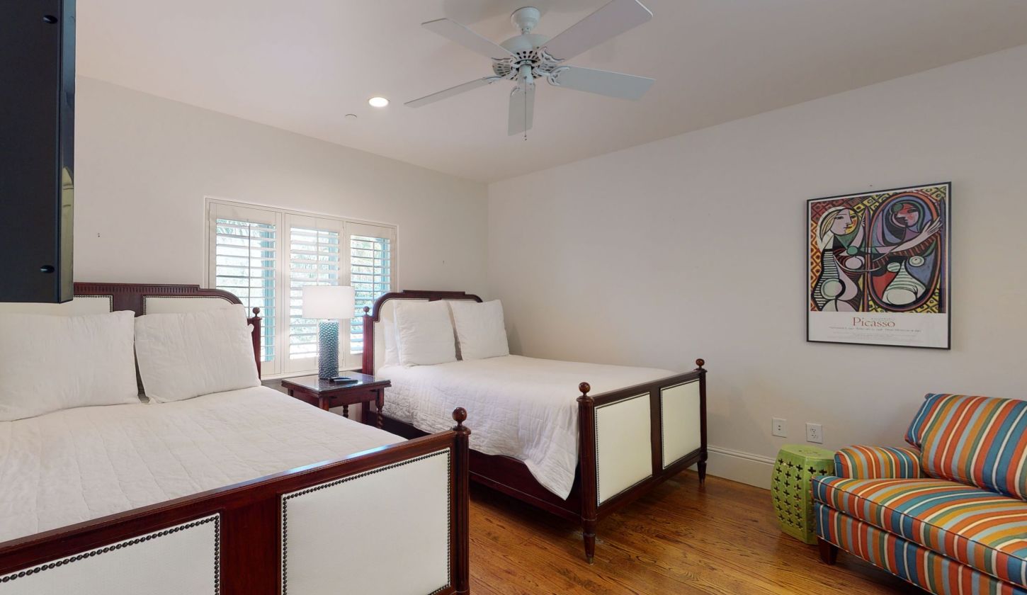 bedroom with two twin beds and colourful chair