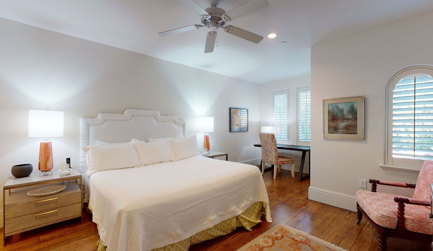 bedroom with sitting area and work desk