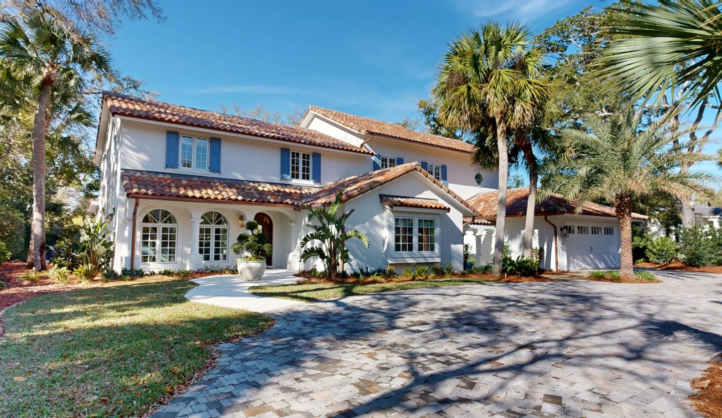The front view of a large white cottage