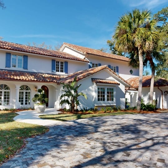 The front view of a large white cottage