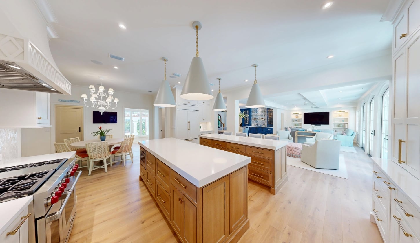 An open concept kitchen with two islands