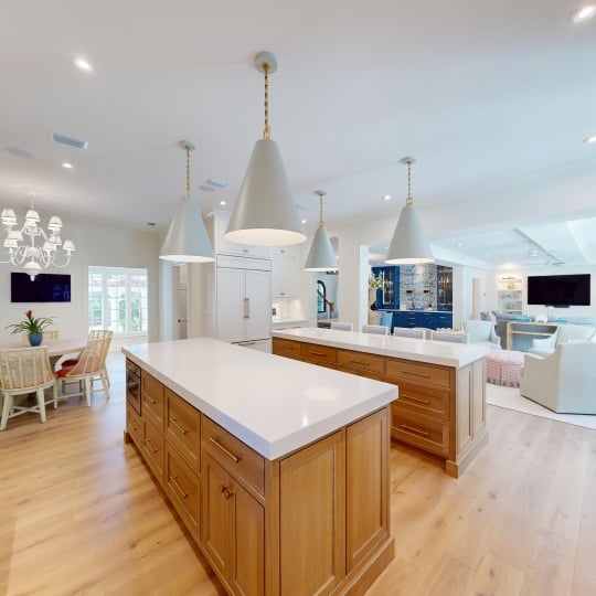 An open concept kitchen with two islands