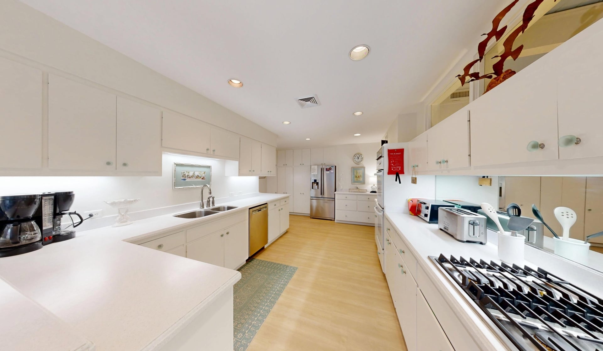A spacious kitchen with white cabinetry