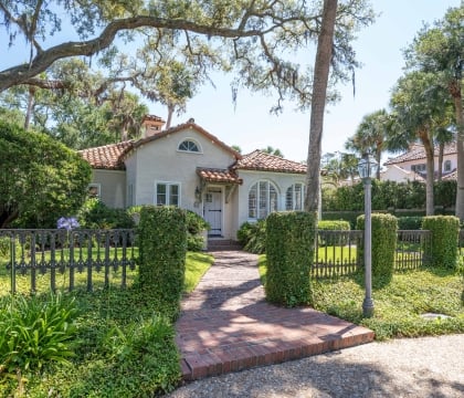 A fenced in property with Spanish architecture