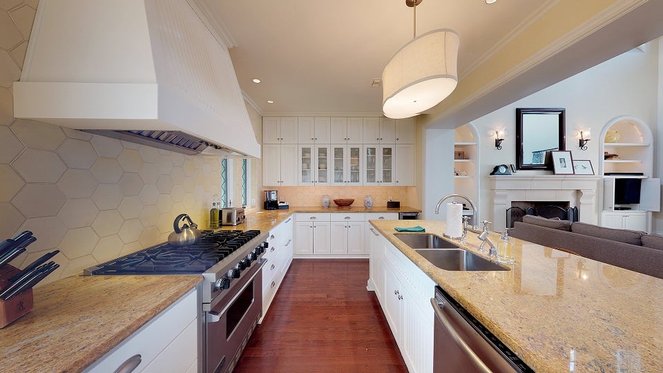 Kitchen with white cabinets and light tan countertops