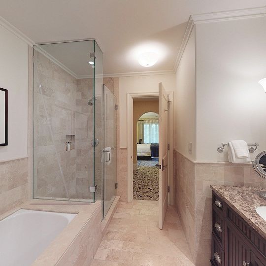 Bathroom with walk-in shower next to soaker tub