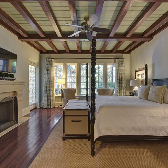 Bedroom with large bed and trunk