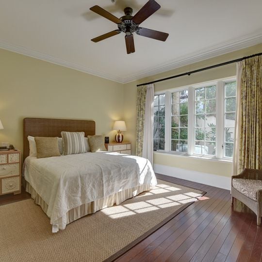 Bedroom with large bed and chair