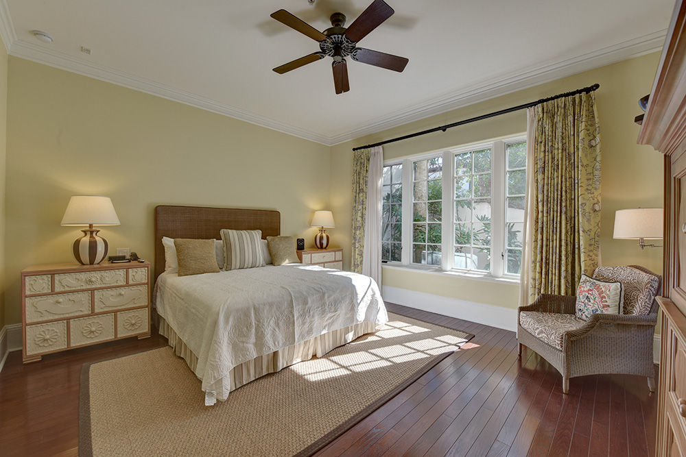 Bedroom with large bed and chair