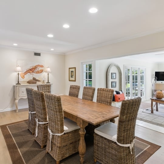 An elegant dining room with a long wooden table