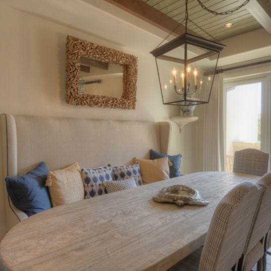 kitchen table with balcony in the background