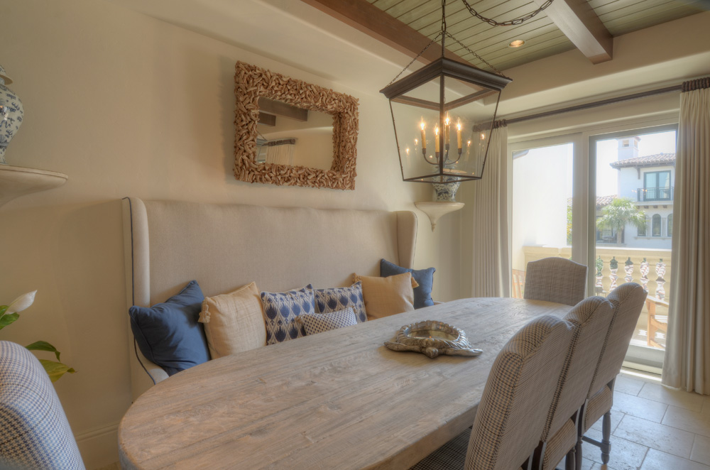 kitchen table with balcony in the background