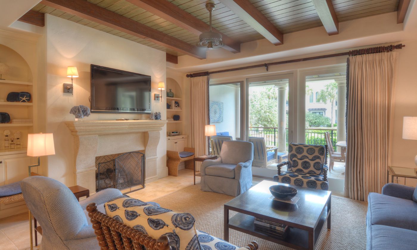 living room with fireplace and built in shelves