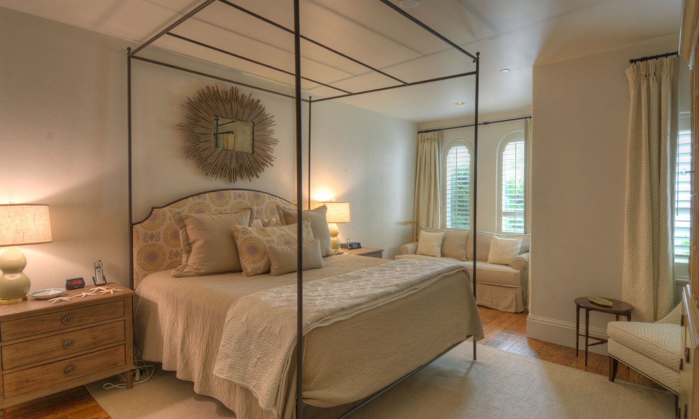 bedroom with a love seat and chair