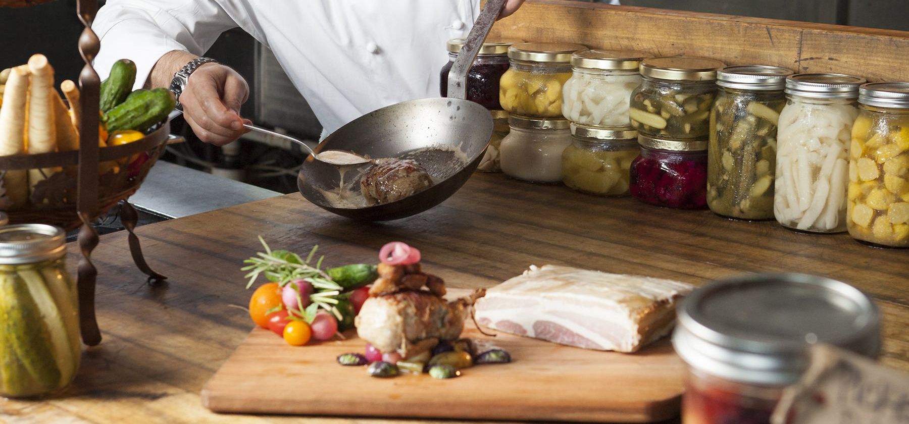 A chef at Sea Island preparing a meal