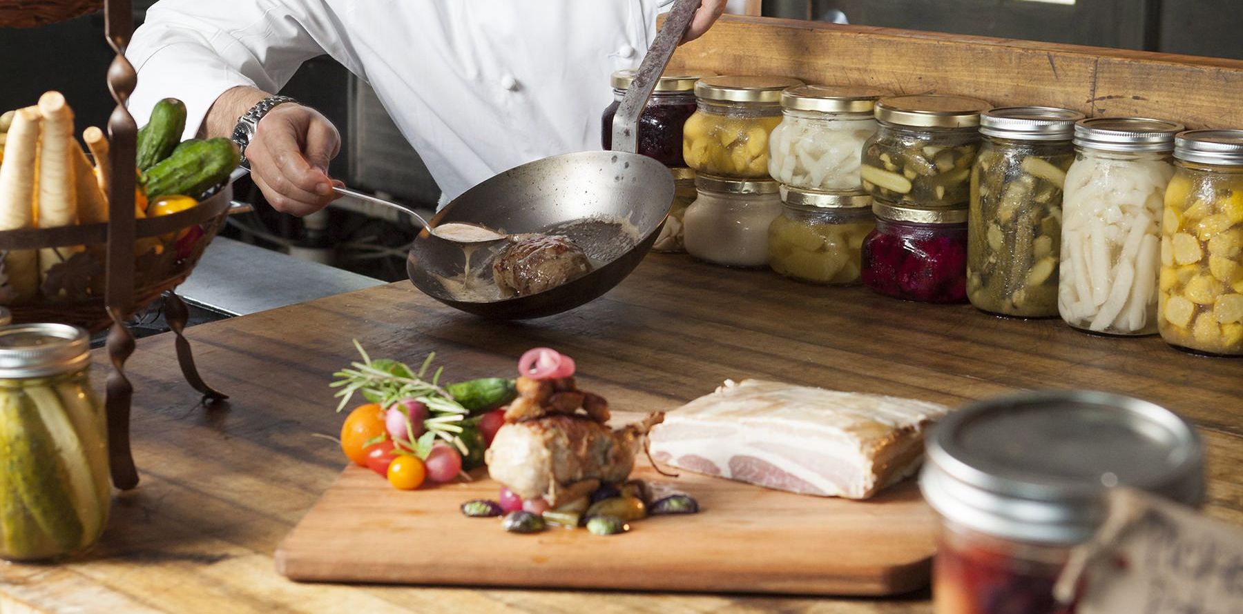A chef at Sea Island preparing a meal